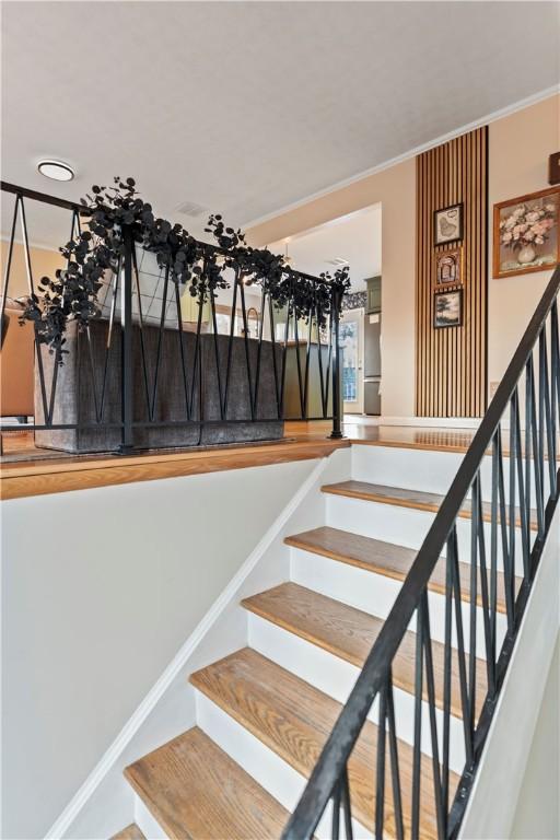 stairs featuring ornamental molding