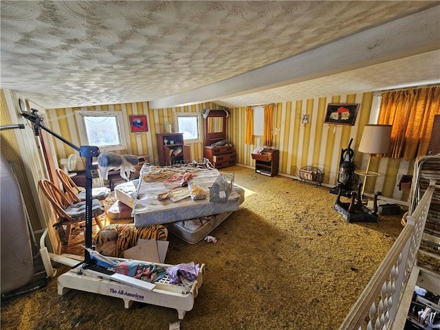 carpeted living area with a textured ceiling