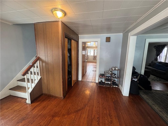 hallway with stairway and wood finished floors