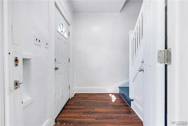 interior space with dark wood finished floors and baseboards