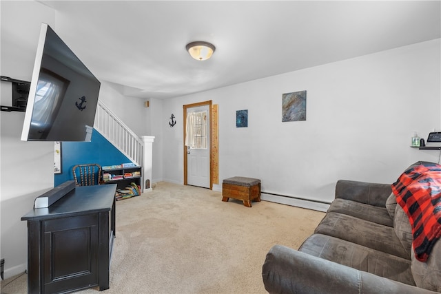 living area featuring a baseboard heating unit, carpet flooring, stairway, and baseboards