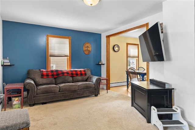 carpeted living area featuring baseboard heating