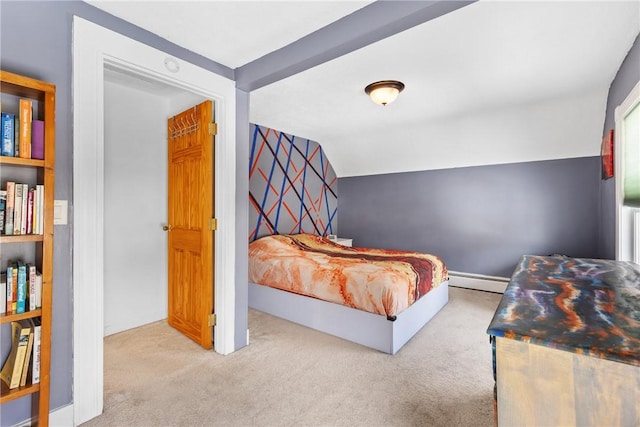 carpeted bedroom featuring vaulted ceiling and baseboard heating