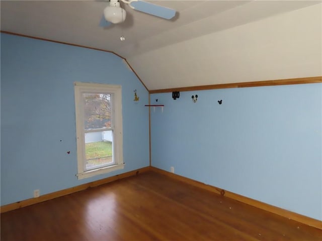 bonus room with a ceiling fan, lofted ceiling, baseboards, and wood finished floors