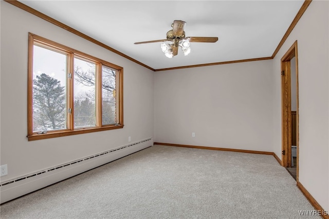 empty room featuring baseboards, ceiling fan, carpet, crown molding, and a baseboard heating unit