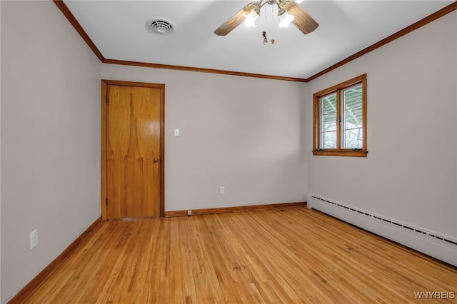 empty room featuring a baseboard radiator, light wood-style flooring, visible vents, baseboards, and ornamental molding