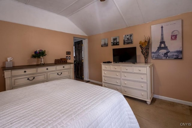 bedroom with vaulted ceiling, carpet, and baseboards