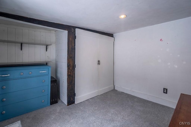 unfurnished bedroom with carpet floors