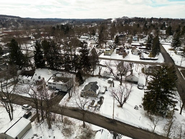 snowy aerial view with a residential view