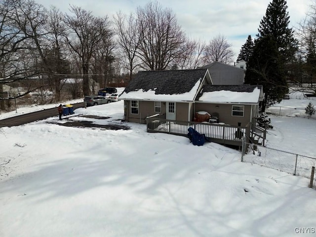 view of front facade featuring fence and a deck