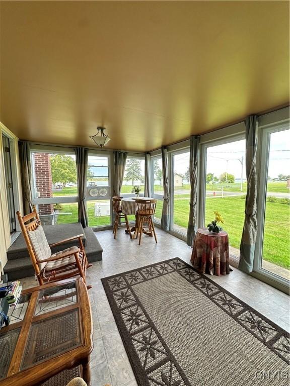 sunroom / solarium featuring plenty of natural light