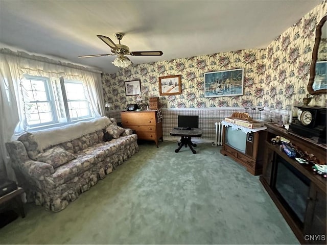 interior space featuring carpet flooring, a ceiling fan, and wallpapered walls