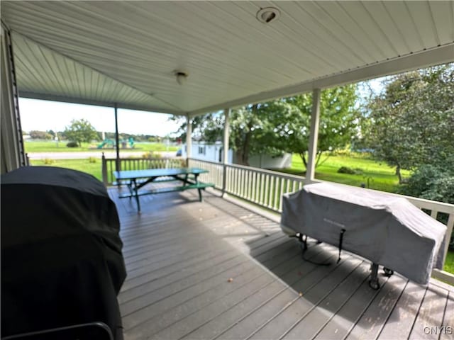 wooden terrace featuring grilling area