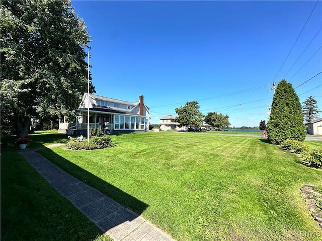 view of yard with a sunroom