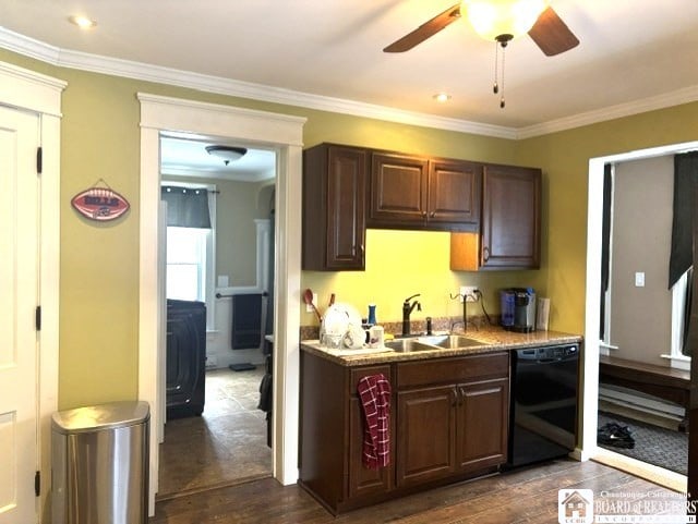 kitchen featuring crown molding, dark wood finished floors, black dishwasher, and a sink