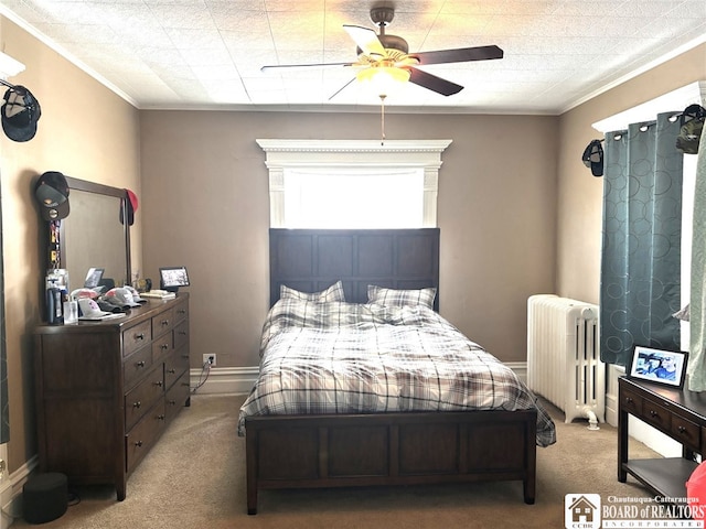 bedroom featuring light carpet, baseboards, a ceiling fan, radiator heating unit, and crown molding