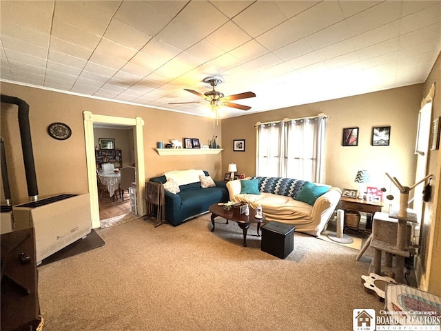 carpeted living room featuring a ceiling fan