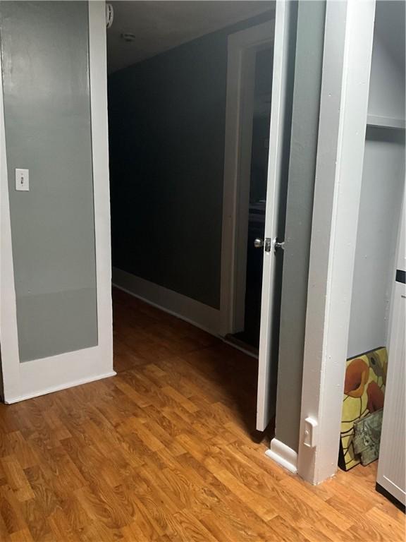 corridor with wood finished floors