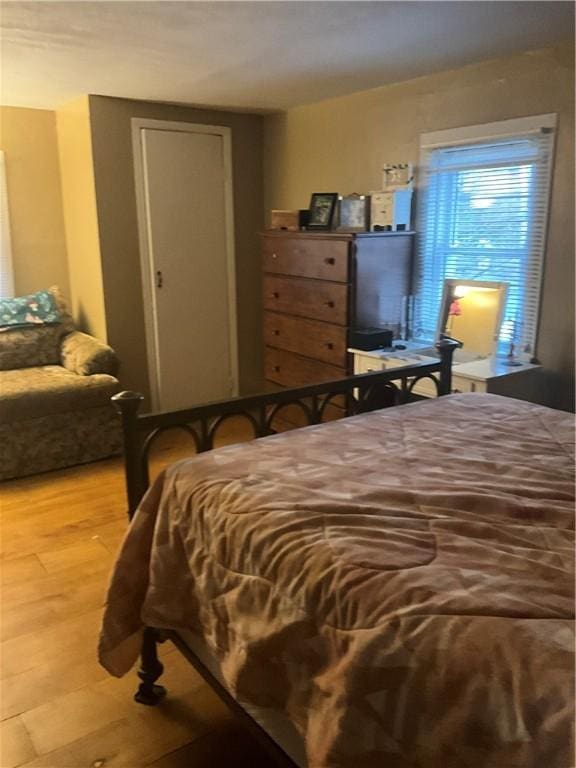 bedroom with light wood finished floors