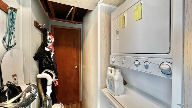 washroom featuring laundry area and stacked washer and clothes dryer