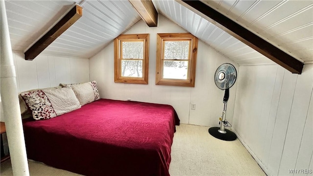 carpeted bedroom featuring vaulted ceiling with beams and wood walls