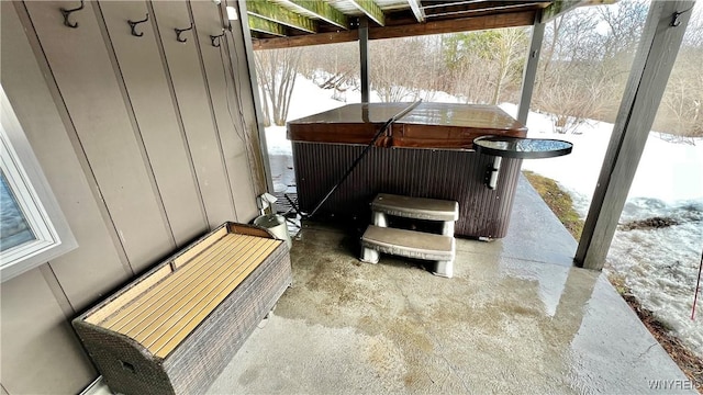 view of patio / terrace with a hot tub