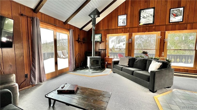 carpeted living room with high vaulted ceiling, a wood stove, wooden walls, and beam ceiling