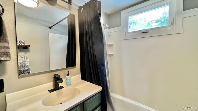 full bathroom with vanity and shower / bathtub combination with curtain