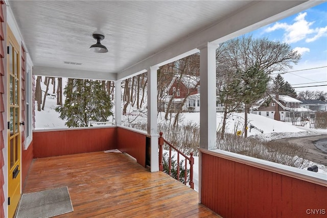 view of snow covered deck