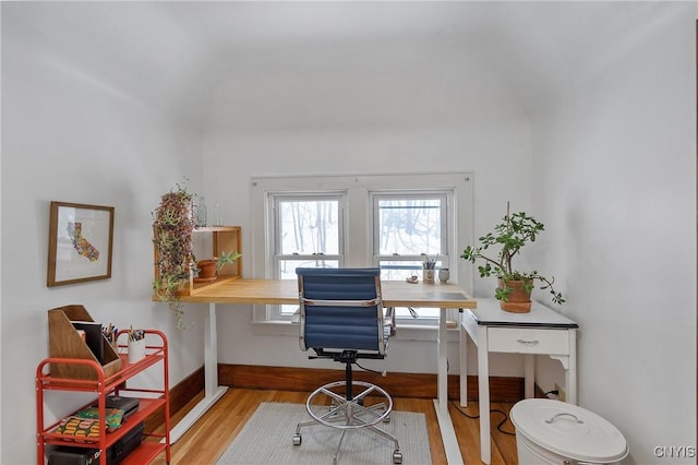 home office with baseboards and wood finished floors