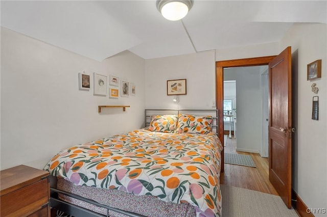 bedroom with wood finished floors