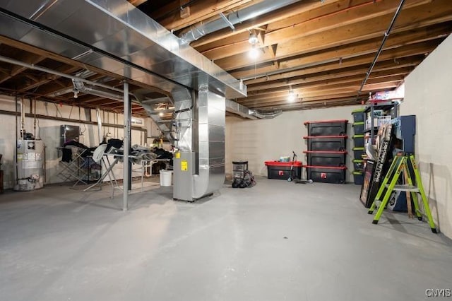 unfinished basement featuring gas water heater and heating unit