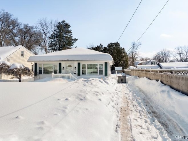 view of front of property featuring fence