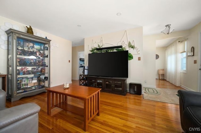 living room with wood finished floors and baseboards