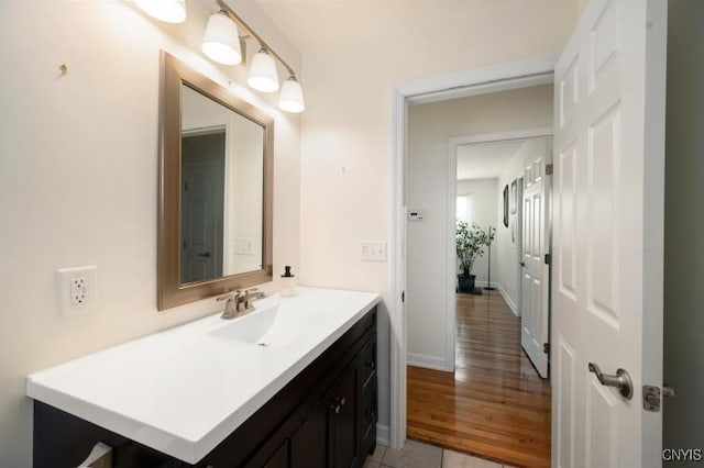 bathroom with vanity and baseboards