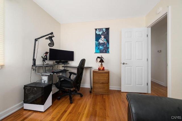 office with baseboards and wood finished floors