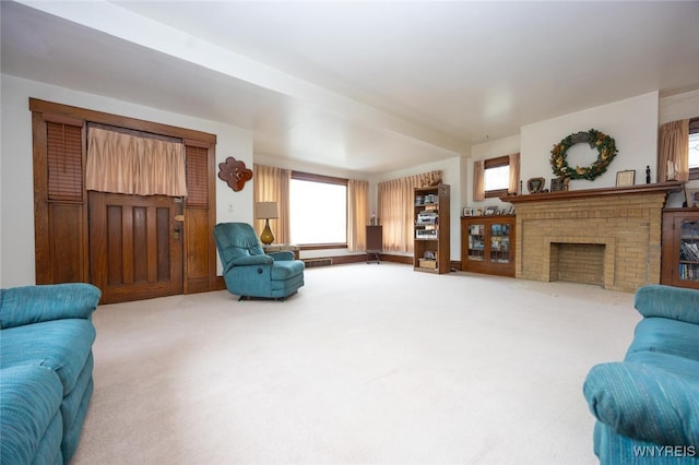 living room with carpet floors, a brick fireplace, and visible vents