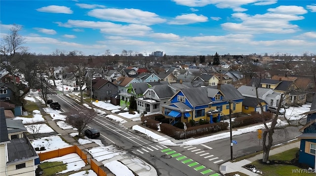 snowy aerial view featuring a residential view