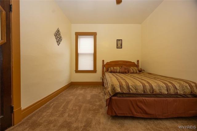 bedroom with carpet floors and baseboards