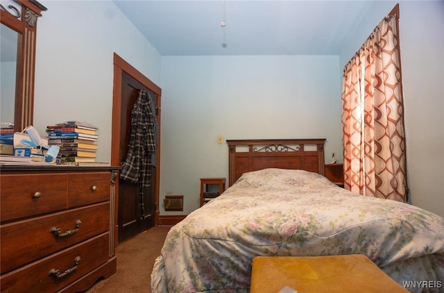 bedroom featuring dark carpet