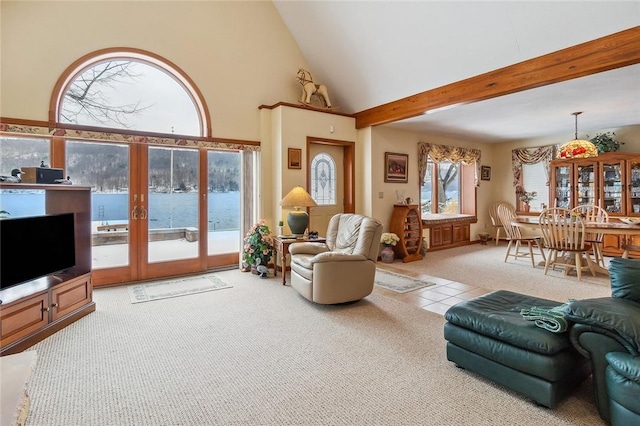 carpeted living area featuring high vaulted ceiling, a water view, french doors, tile patterned floors, and beamed ceiling