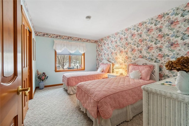 bedroom with baseboards, carpet floors, and wallpapered walls