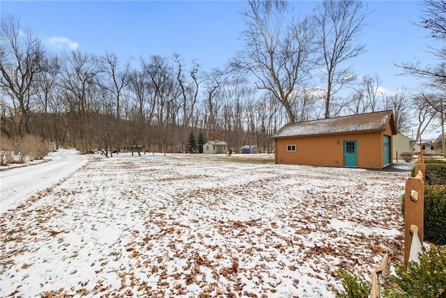 view of yard layered in snow