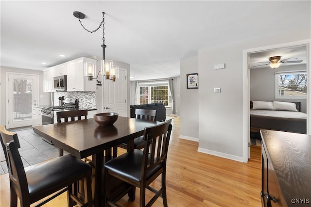 dining room with recessed lighting, ceiling fan, light wood-style flooring, and baseboards