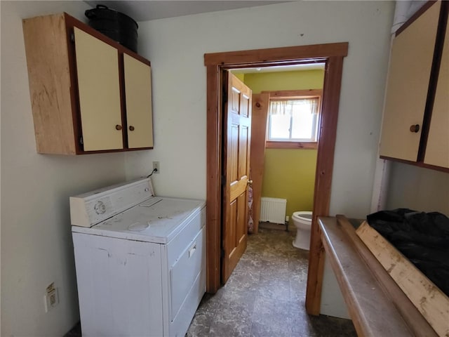 washroom with laundry area, radiator heating unit, and washer / clothes dryer