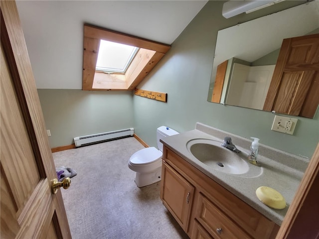 bathroom with toilet, a skylight, a baseboard radiator, and vanity