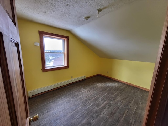 bonus room featuring a textured ceiling, lofted ceiling, a baseboard radiator, baseboards, and dark wood finished floors