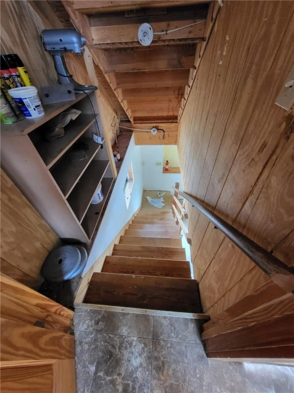 stairway with wood walls