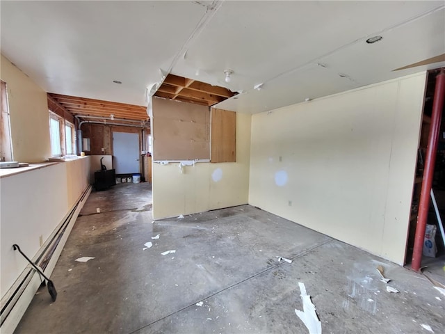 spare room featuring a baseboard heating unit