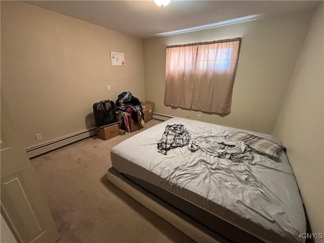 carpeted bedroom featuring a baseboard radiator